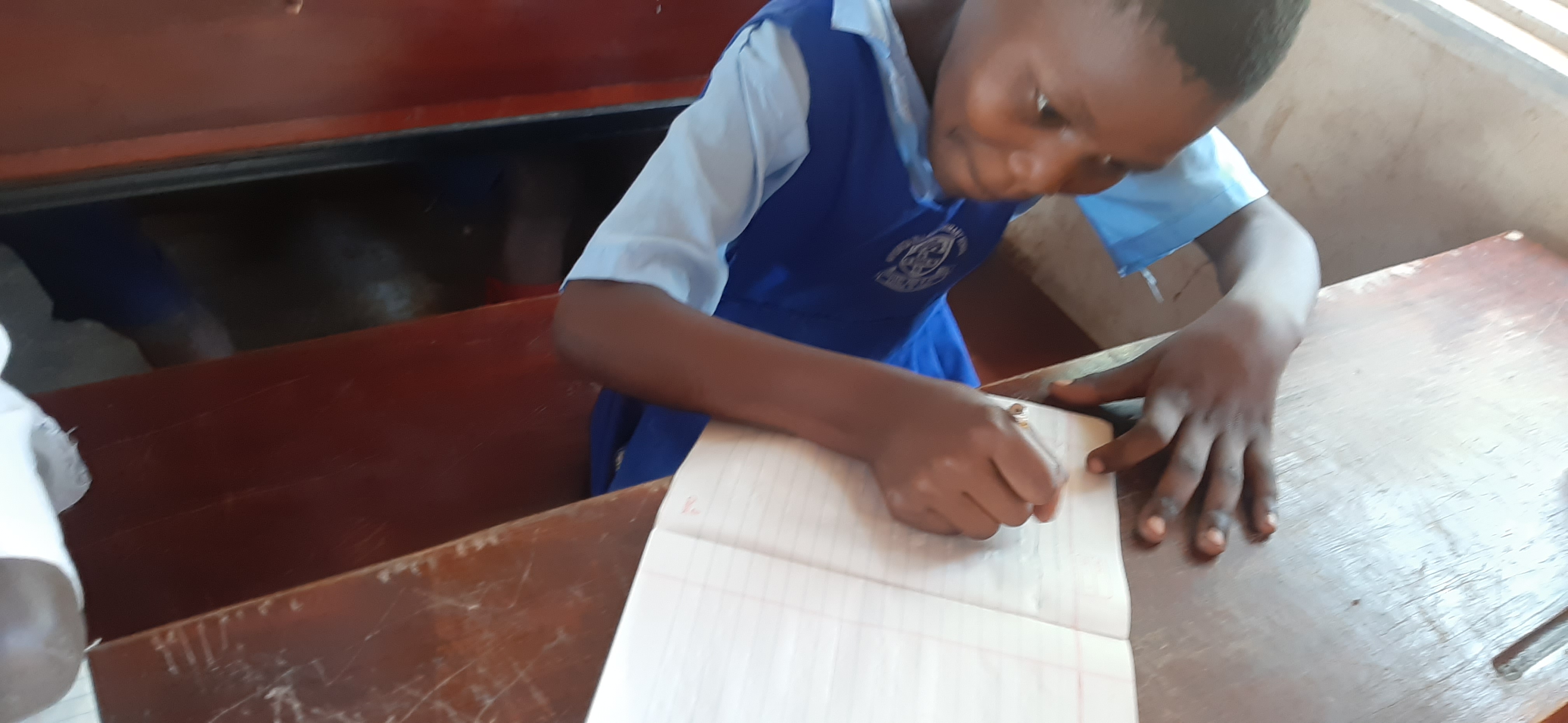 uganda_child_writing